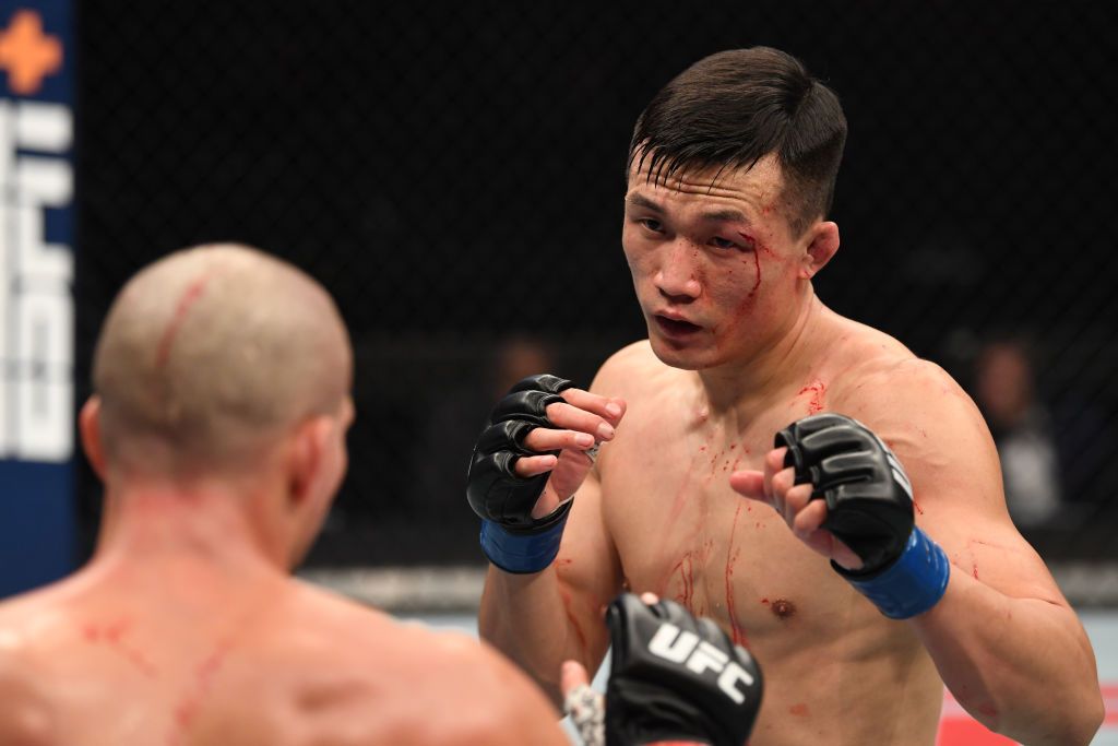 ABU DHABI, UNITED ARAB EMIRATES - OCTOBER 18: In this handout image provided by UFC, (R-L) The Korean Zombie Chan Sung Jung battles Brian Ortega in their featherweight bout during the UFC Fight Night event inside Flash Forum on UFC Fight Island on October 18, 2020 in Abu Dhabi, United Arab Emirates. (Photo by Josh Hedges/Zuffa LLC via Getty Images)