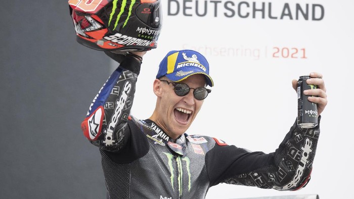 HOHENSTEIN-ERNSTTHAL, GERMANY - JUNE 20: Fabio Quartararo of France and Monster Energy Yamaha MotoGP Team celebrates the third place on the podium during the MotoGP race during the MotoGP of Germany - Race at Sachsenring Circuit on June 20, 2021 in Hohenstein-Ernstthal, Germany. (Photo by Mirco Lazzari gp/Getty Images)