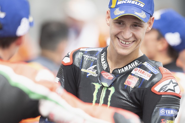 HOHENSTEIN-ERNSTTHAL, GERMANY - JUNE 20: Fabio Quartararo of France and Monster Energy Yamaha MotoGP Team celebrates the third place under the podium during the MotoGP race during the MotoGP of Germany - Race at Sachsenring Circuit on June 20, 2021 in Hohenstein-Ernstthal, Germany. (Photo by Mirco Lazzari gp/Getty Images)