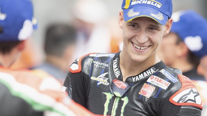 HOHENSTEIN-ERNSTTHAL, GERMANY - JUNE 20: Fabio Quartararo of France and Monster Energy Yamaha MotoGP Team celebrates the third place under the podium during the MotoGP race during the MotoGP of Germany - Race at Sachsenring Circuit on June 20, 2021 in Hohenstein-Ernstthal, Germany. (Photo by Mirco Lazzari gp/Getty Images)