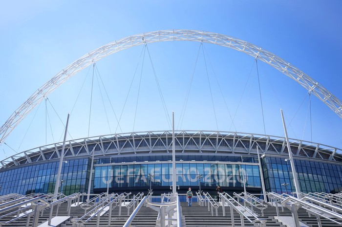 FILE - In this Wednesday, June 9, 2021 file photo, a view of the entrance to Wembley stadium, ahead of the Euro 2020 soccer championship in London. The British government says more than 60,000 fans will be allowed into the semifinals and final of the European Championship at Wembley Stadium. No details have been provided yet on how fans from overseas can attend without having to quarantine after flying into London. (AP Photo/Frank Augstein, File)