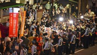 Terlebih Jepang saat ini masih berjibaku menanggulangi penyebaran COVID-19 di negaranya. AP Photo/Eugene Hoshiko.