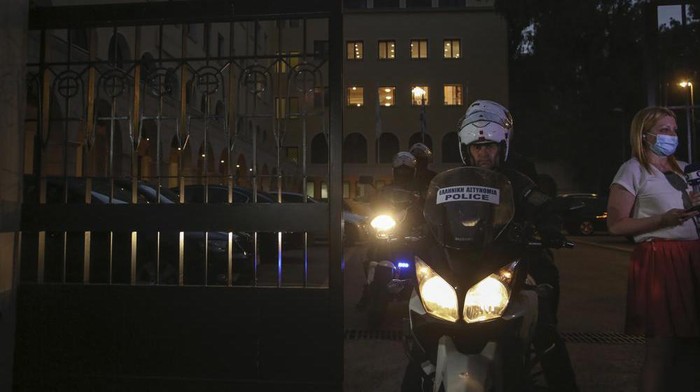 A police officer on a motorcycle exits the Petraki Monastery in Athens, following an attack with a caustic liquid on Wednesday, June 23, 2021. Greek authorities say seven Greek Orthodox bishops have been hospitalized after allegedly being attacked with a caustic liquid by a priest facing a disciplinary hearing in Athens. The incident occurred at a meeting of senior church officials late Wednesday. (AP Photo/Petros Giannakouris)