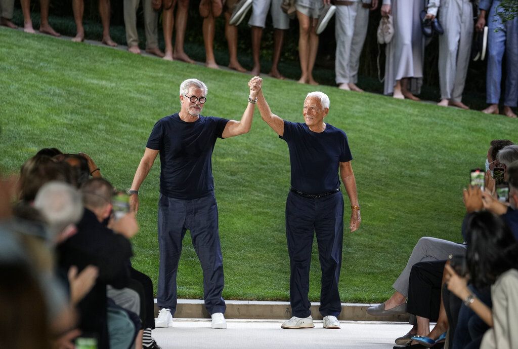 Models wear creations as part of the Giorgio Armani men's Spring Summer 2022 collection, in Milan, Italy, Monday, June 21, 2021. (AP Photo/Luca Bruno)