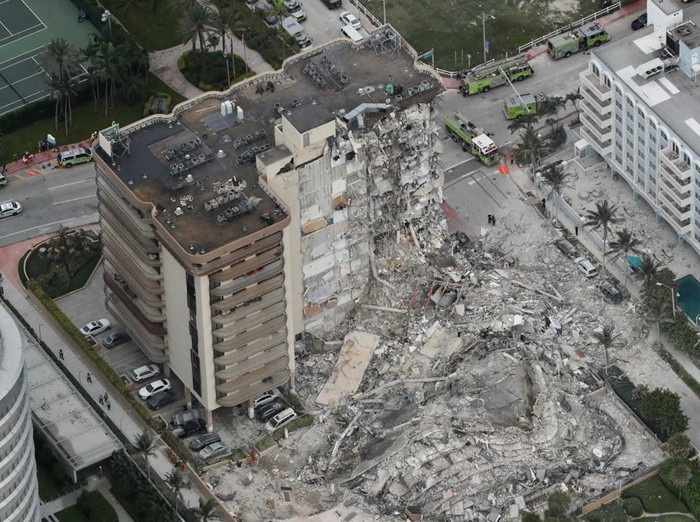 This aerial photo shows part of the 12-story oceanfront Champlain Towers South Condo that collapsed early Thursday, June 24, 2021 in Surfside, Fla. (Amy Beth Bennett /South Florida Sun-Sentinel via AP)