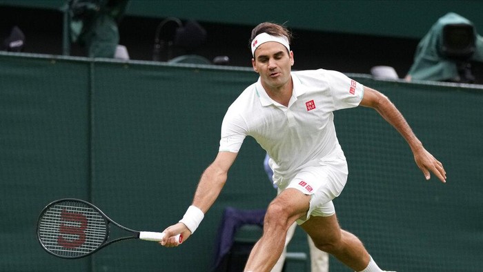 Switzerlands Roger Federer plays a return to Adrian Mannarino of France during the mens singles first round match against on day two of the Wimbledon Tennis Championships in London, Tuesday June 29, 2021. (AP Photo/Kirsty Wigglesworth)