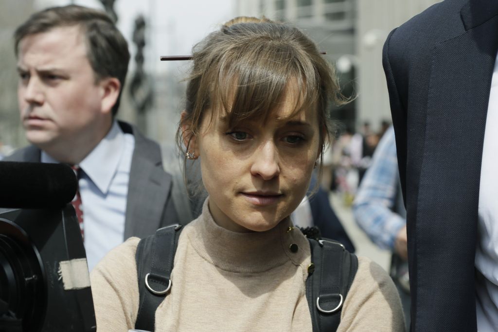 Allison Mack FILE - Allison Mack leaves Federal court in the Brooklyn borough of New York on April 24, 2018. Mack, an actress best known for playing a young Superman's friend, was sentenced to 3 years in prison for role in NXIVM sex-slave case. (AP Photo/Frank Franklin II, File)