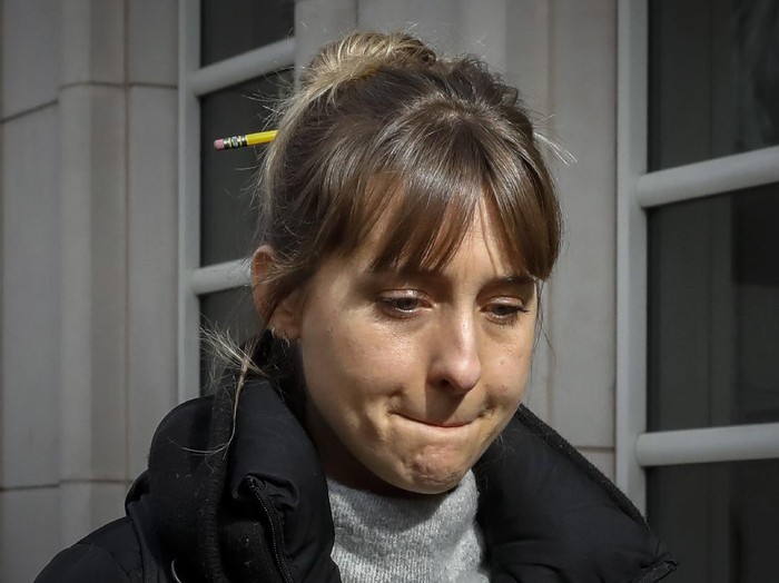 FILE - Allison Mack leaves Federal court in the Brooklyn borough of New York on April 24, 2018. Mack, an actress best known for playing a young Supermans friend, was sentenced to 3 years in prison for role in NXIVM sex-slave case. (AP Photo/Frank Franklin II, File)