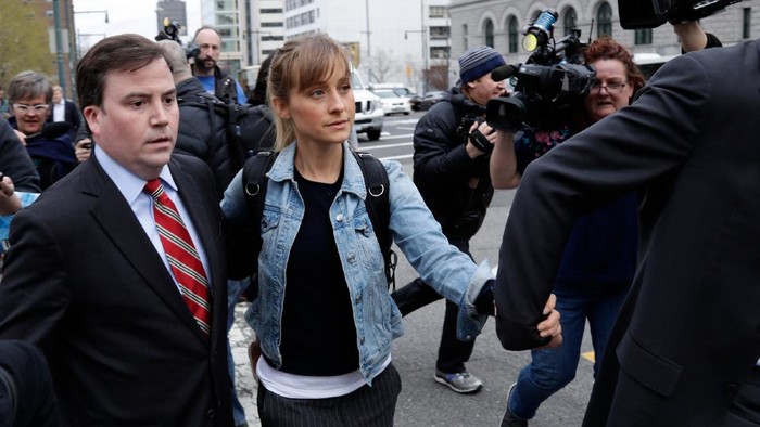 FILE - Allison Mack leaves Federal court in the Brooklyn borough of New York on April 24, 2018. Mack, an actress best known for playing a young Supermans friend, was sentenced to 3 years in prison for role in NXIVM sex-slave case. (AP Photo/Frank Franklin II, File)