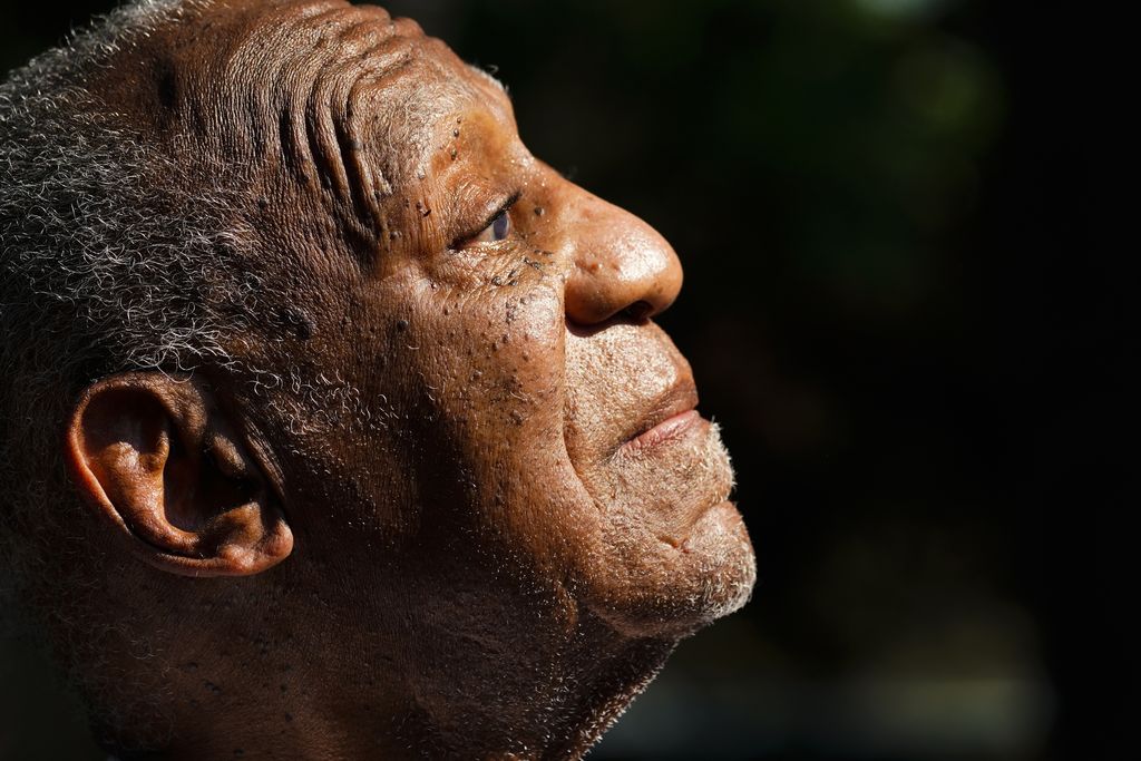 Bill Cosby listens to members of his team speak during a news conference outside his home in Elkins Park, Pa., Wednesday, June 30, 2021, after being released from prison. Pennsylvania's highest court has overturned comedian Cosby's sex assault conviction. The court said Wednesday, that they found an agreement with a previous prosecutor prevented him from being charged in the case. The 83-year-old Cosby had served more than two years at the state prison near Philadelphia and was released.(AP Photo/Matt Rourke)