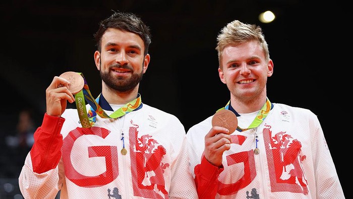 RIO DE JANEIRO, BRAZIL - AUGUST 19:  (L-R) Bronze medalists Chris Langridge and Marcus Ellis of Great Britain stand on the podium during the medal ceremony after the Mens Badminton Doubles competition on Day 14 of the Rio 2016 Olympic Games at Riocentro - Pavilion 4 on August 19, 2016 in Rio de Janeiro, Brazil.  (Photo by Clive Brunskill/Getty Images)