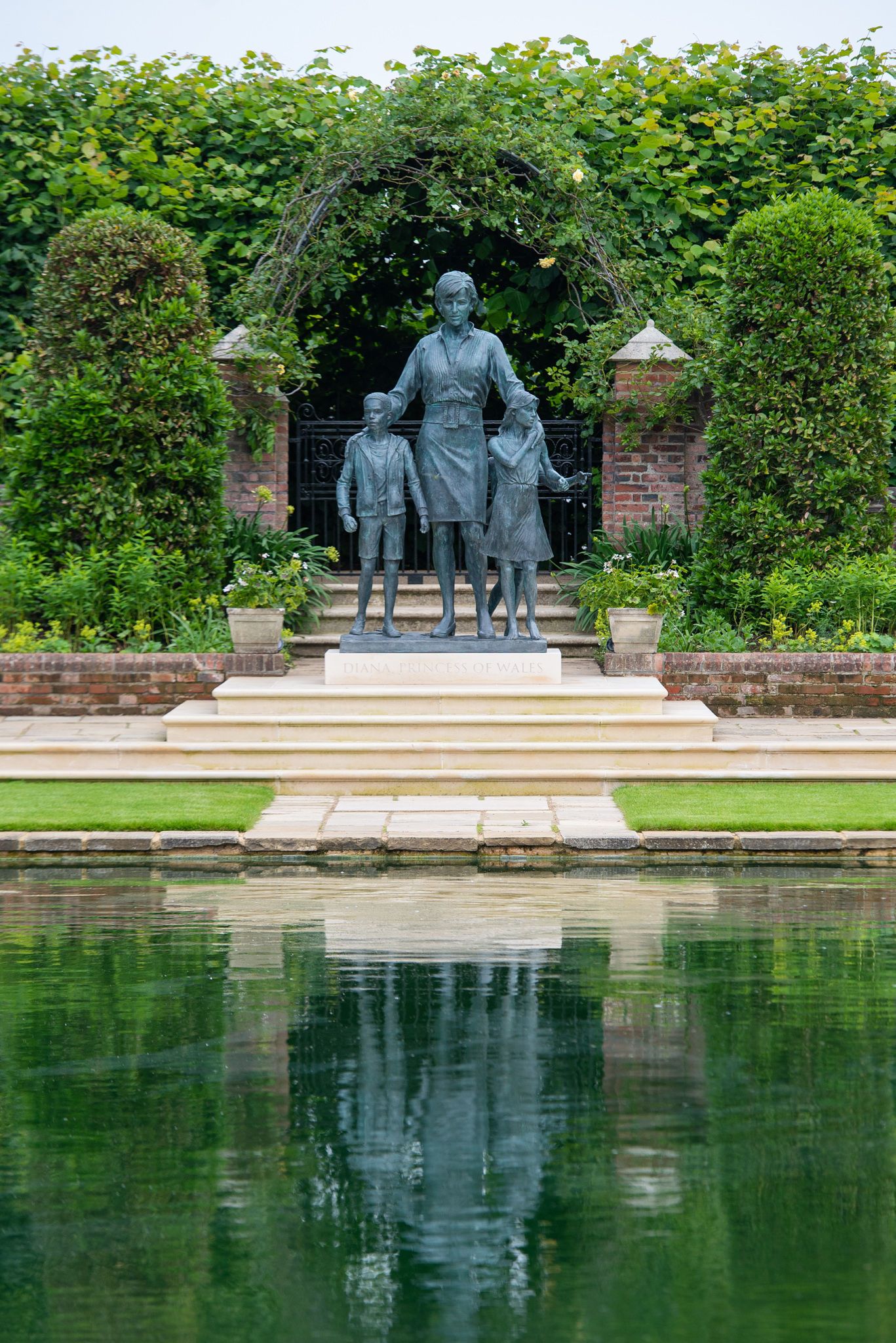 LONDON, ENGLAND - JULY 01: Sculptor, Ian Rank-Broadley poses with his Diana, Princess of Wales statue in the Sunken Garden at Kensington Palace, following the unveiling on July 1, 2021 in London, England. Today would have been the 60th birthday of Princess Diana, who died in 1997. At a ceremony here today, her sons Prince William, Duke of Cambridge and Prince Harry, Duke of Sussex unveiled a statue in her memory. (Photo by Dominic Lipinski - WPA Pool/Getty Images)