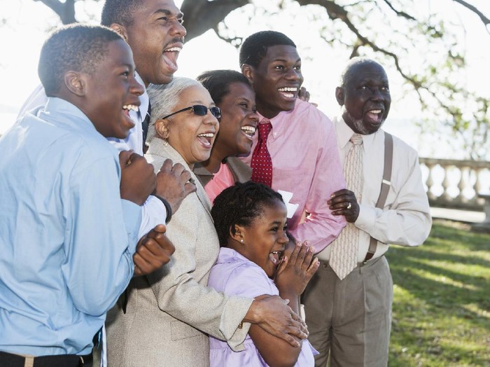 488874641 Multi-generation African American family: children (5, 7, 13 and 17 years) with parents (40s) and grandparents (60s, 70s).