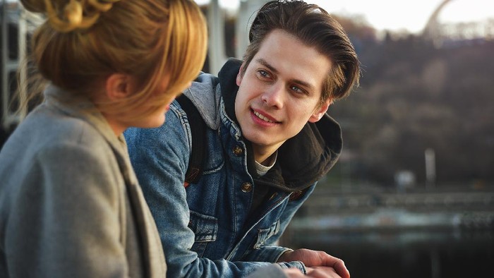 Young beautiful couple enjoying their time. Man and woman laugh and talk