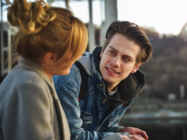 Young beautiful couple enjoying their time. Man and woman laugh and talk
