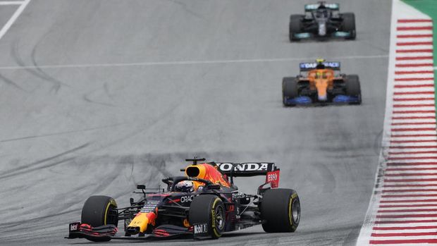 Red Bull driver Max Verstappen of the Netherlands, left, steers his car during the Austrian Formula One Grand Prix at the Red Bull Ring racetrack in Spielberg, Austria, Sunday, July 4, 2021. (AP Photo/Darko Bandic)