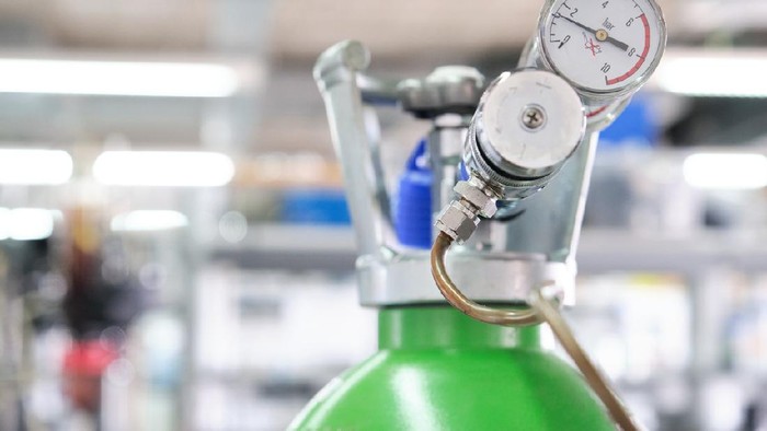 Gas cylinders with pressure gauge in a specialized laboratory. Laboratory material.