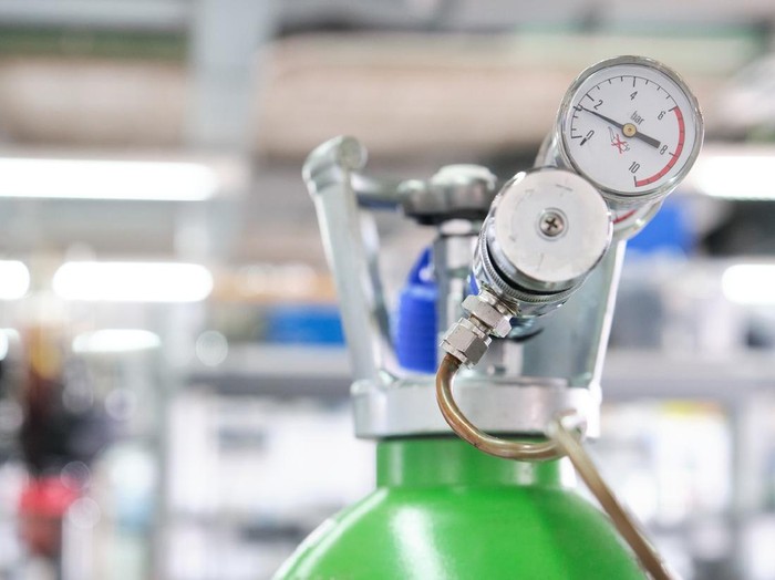 Gas cylinders with pressure gauge in a specialized laboratory. Laboratory material.