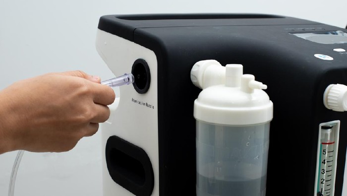 1270432327 Medical Device Individual portable oxygen cylinder to put gas for patients with respiratory disorders, Oxygen concentrator bar gauge measurement liter made pure water min max level, white background