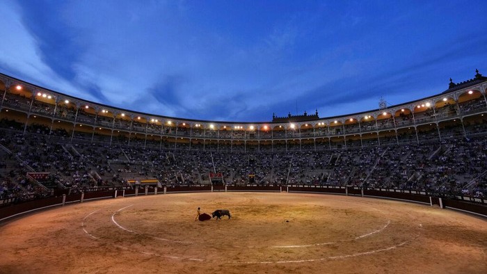 People keep a social distance while attending a bullfight amid the coronavirus pandemic at Las Ventas bullring in Madrid, Spain, Saturday, June 26, 2021. (AP Photo/Manu Fernandez)