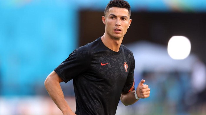 SEVILLE, SPAIN - JUNE 27: Cristiano Ronaldo of Portugal looks on as he warms up prior to the UEFA Euro 2020 Championship Round of 16 match between Belgium and Portugal at Estadio La Cartuja on June 27, 2021 in Seville, Spain. (Photo by Alexander Hassenstein/Getty Images)