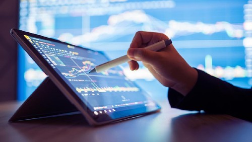 Woman looking stock market Data on smart phone