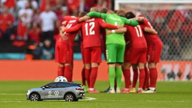 LONDON, ENGLAND - JULY 07: A detailed view of the Adidas Uniforia match ball is seen in the Volkswagen Remote Control Mini Car as it is delivered on to the pitch whilst the players of Denmark form a huddle prior to the UEFA Euro 2020 Championship Semi-final match between England and Denmark at Wembley Stadium on July 07, 2021 in London, England. (Photo by Paul Ellis - Pool/Getty Images)