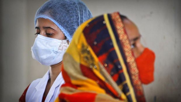 A health worker prepares to administer the vaccine for COVID-19 in New Delhi, India, Friday, July 2, 2021. India crosses a grim mark of 400,000 people lost to the coronavirus, half of them in the past two months during which the virulent delta variant was detected in the country. India, a country of nearly 1.4 billion people, is the third to cross 400,000 deaths, behind the United States and Brazil. (AP Photo/Manish Swarup)