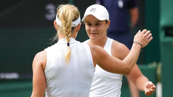 Australias Ashleigh Barty greets Germanys Angelique Kerber at the end of the womens singles semifinals match on day ten of the Wimbledon Tennis Championships in London, Thursday, July 8, 2021. (AP Photo/Alberto Pezzali)