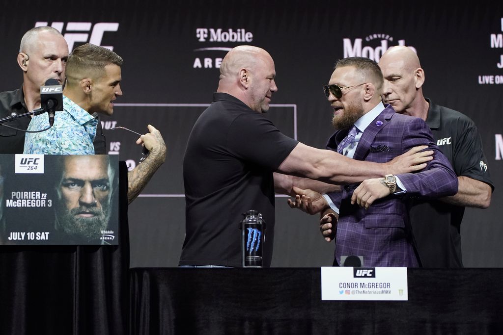 Conor McGregor adjusts his glasses during a news conference for a UFC 264 mixed martial arts bout Thursday, July 8, 2021, in Las Vegas. McGregor is scheduled to fight Dustin Poirier in a lightweight bout Saturday in Las Vegas (AP Photo/John Locher)