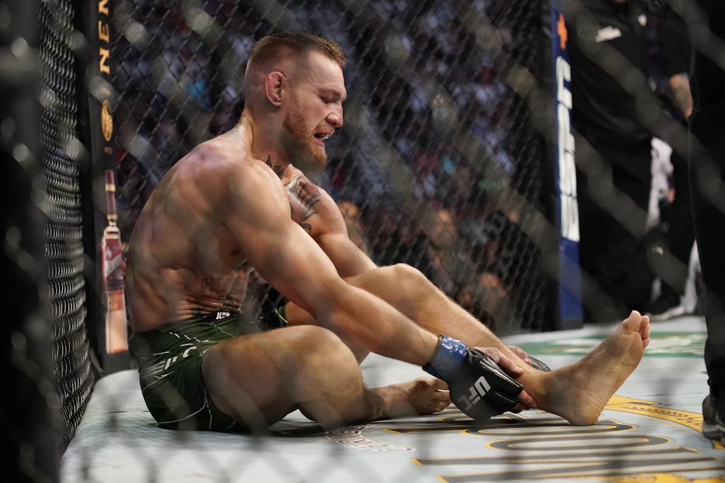 Conor McGregor, left, fights Dustin Poirier during a UFC 264 lightweight mixed martial arts bout Saturday, July 10, 2021, in Las Vegas. (AP Photo/John Locher)