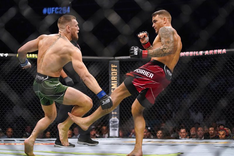 Conor McGregor, left, faces Dustin Poirier in a UFC 264 lightweight mixed martial arts bout Saturday, July 10, 2021, in Las Vegas. (AP Photo/John Locher)