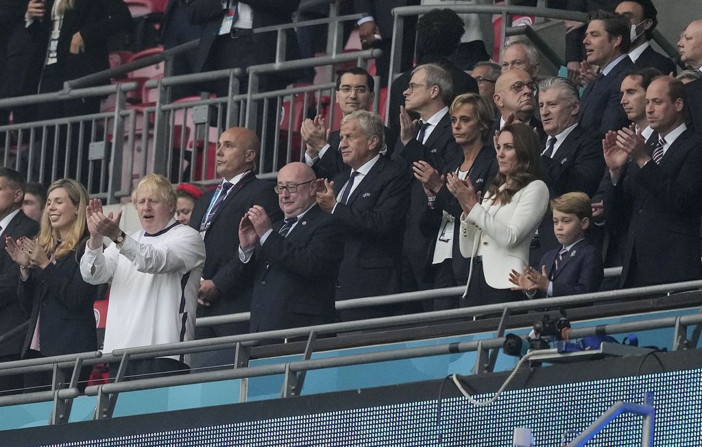 Prince William, his son Prince George and Duchess Catherine, from right, stand on the tribune prior the Euro 2020 soccer championship final between England and Italy at Wembley stadium in London, Sunday, July 11, 2021. (AP Photo/Frank Augstein, Pool)