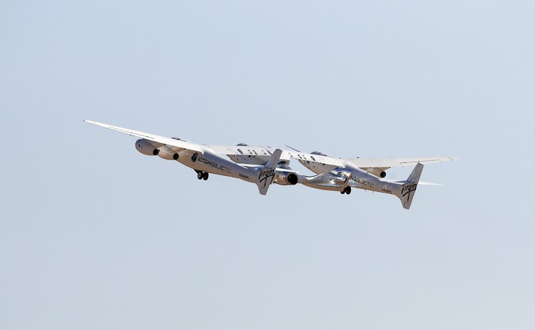 Special guests chat as they wait for Virgin Galactic founder Richard Bransons launch to space aboard his own rocket ship near Truth or Consequences, New Mexico, Sunday, July 11, 2021. (AP Photo/Andres Leighton)