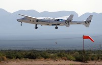 Special guests chat as they wait for Virgin Galactic founder Richard Bransons launch to space aboard his own rocket ship near Truth or Consequences, New Mexico, Sunday, July 11, 2021. (AP Photo/Andres Leighton)