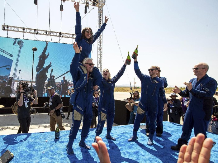 Special guests chat as they wait for Virgin Galactic founder Richard Bransons launch to space aboard his own rocket ship near Truth or Consequences, New Mexico, Sunday, July 11, 2021. (AP Photo/Andres Leighton)