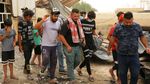 Potret Evakuasi Korban Kebakaran RS COVID-19 di Irak