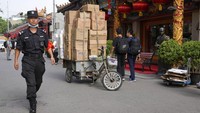 Dalam data yang dirilis dilaporkan bahwa ekonomi China tumbuh 7,9%. AP Photo/Ng Han Guan