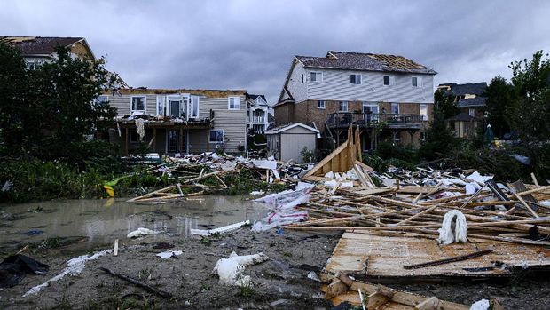 Damage left after a tornado touched down in a neighborhood of Barrie, Ontario, on Thursday, July 15, 2021. (Christopher Katsarov/The Canadian Press via AP)