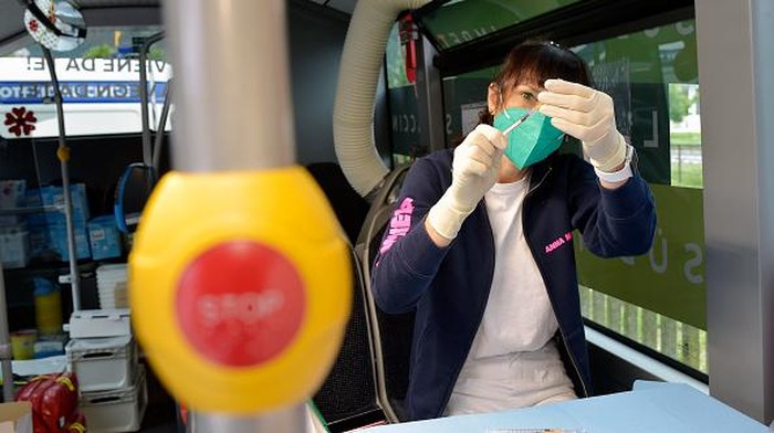 BOLZANO, ITALY - JULY 14: People receive their Covid-19 vaccine in one of two SASA buses equipped as vaccination centers, operating in the small towns of South Tyrol, on July 14, 2021 in Bolzano, Italy. Italy has administered some 58,213,710 doses of Covid vaccines to the population, accounting for 48.3% of the country's population. Covid-19 infections are increasing in Italy, with 1,195 new infections reported on average each day. (Photo by Alessio Coser/Getty Images)