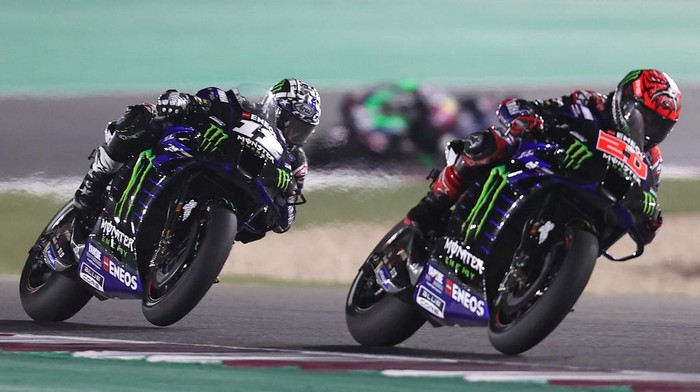 Monster Energy Yamaha MotoGPs French rider Fabio Quartararo (R) and Monster Energy Yamaha MotoGPs Spanish rider Maverick Vinales drive during the Moto GP Grand Prix of Doha at the Losail International Circuit, in the city of Lusail on April 4, 2021. (Photo by KARIM JAAFAR / AFP)