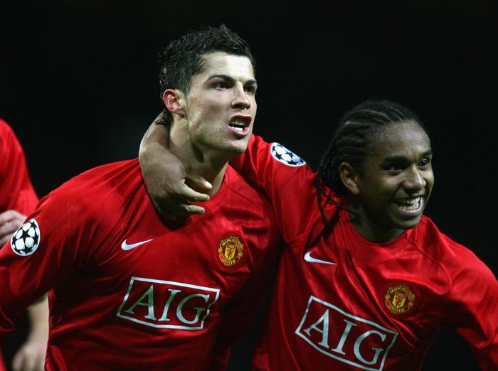 MANCHESTER, UNITED KINGDOM - MARCH 04:  Cristiano Ronaldo of Manchester United celebrates scoring the opening goal with team mate Anderson (R) during the UEFA Champions League first knockout round second leg match between Manchester United and Lyon at Old Trafford on March 4, 2008 in Manchester, England.  (Photo by Alex Livesey/Getty Images)