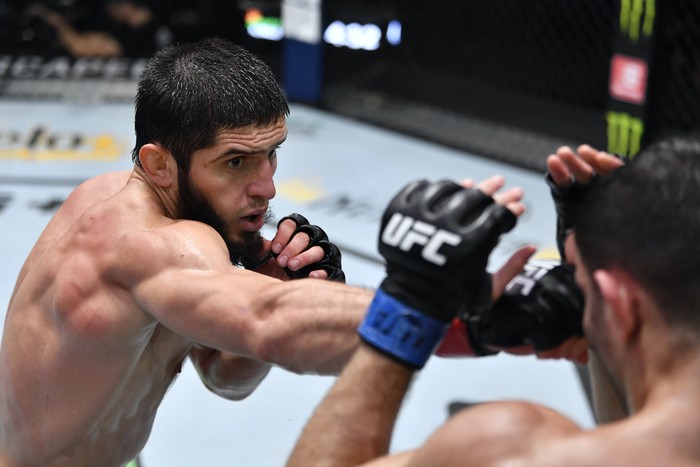LAS VEGAS, NEVADA - JULY 17: (L-R) Islam Makhachev of Russia punches Thiago Moises of Brazil in their lightweight bout during the UFC Fight Night event at UFC APEX on July 17, 2021 in Las Vegas, Nevada. (Photo by Jeff Bottari/Zuffa LLC)