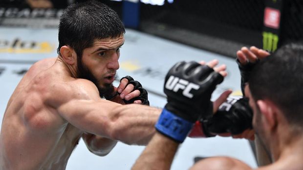 LAS VEGAS, NEVADA - JULY 17: (L-R) Islam Makhachev of Russia punches Thiago Moises of Brazil in their lightweight bout during the UFC Fight Night event at UFC APEX on July 17, 2021 in Las Vegas, Nevada. (Photo by Jeff Bottari/Zuffa LLC)