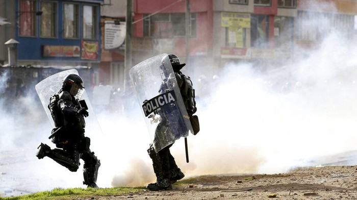 Protesters clash with police during an anti-government protest in Bogota, Colombia, Tuesday, July 20, 2021, as the county marks its Independence Day. (AP Photo/Leonardo Munoz)