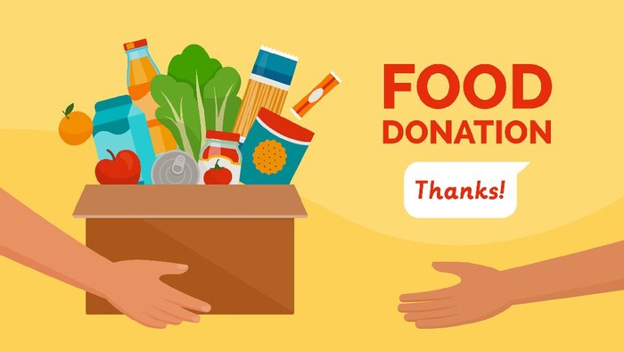 Volunteer holding a donation box with food, awareness and charity concept