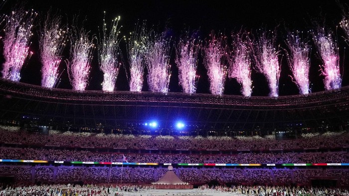 Fireworks explode during the opening ceremony in the Olympic Stadium at the 2020 Summer Olympics, Friday, July 23, 2021, in Tokyo, Japan. (AP Photo/Kirsty Wigglesworth)