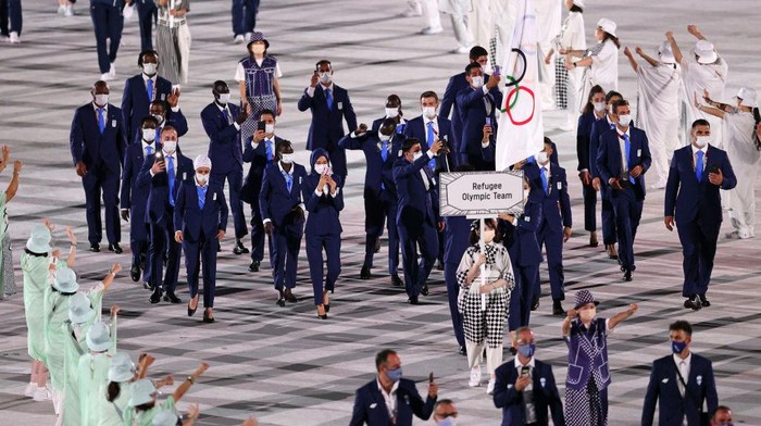 TOKYO, JAPAN - JULY 23: Flag bearers Yusra Mardini and Tachlowini Gabriyesos of The Refugee Olympic Team during the Opening Ceremony of the Tokyo 2020 Olympic Games at Olympic Stadium on July 23, 2021 in Tokyo, Japan. (Photo by Patrick Smith/Getty Images)