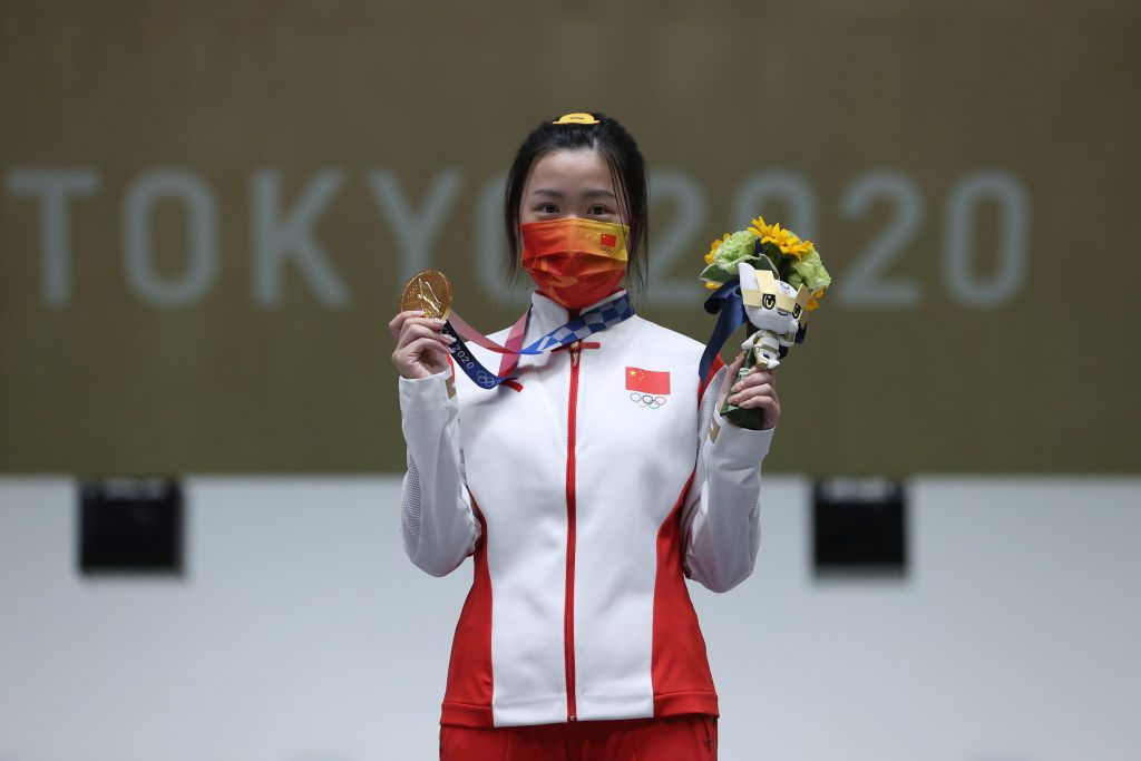 ASAKA, JAPAN - JULY 24: Gold Medalist Qian Yang of Team China poses on the podium during the medal ceremony for the 10m Air Rifle Women's event on day one of the Tokyo 2020 Olympic Games at Asaka Shooting Range on July 24, 2021 in Asaka, Saitama, Japan. (Photo by Kevin C. Cox/Getty Images)