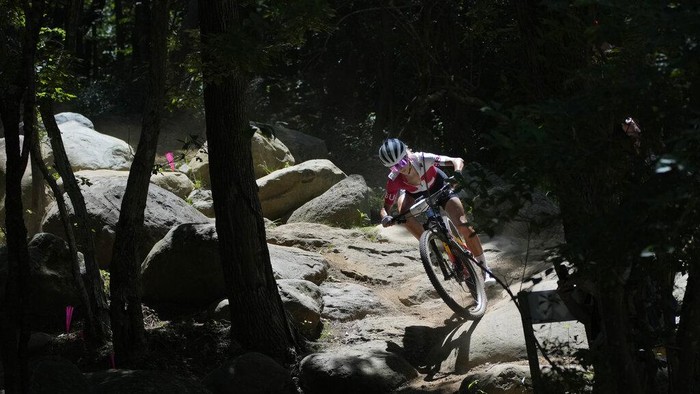 Tokyo Olympics Mountain Bike Cycling Jolanda Neff of Switzerland rides during a training for the Mountain Bike Cycling race at the 2020 Summer Olympics, Friday, July 23, 2021, in Izu, Japan. (AP Photo/Christophe Ena)